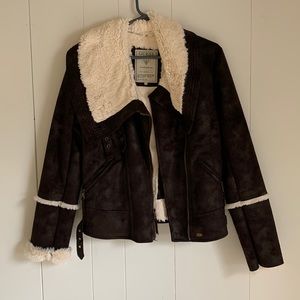 Guess dark brown with cream fleece detail and interior